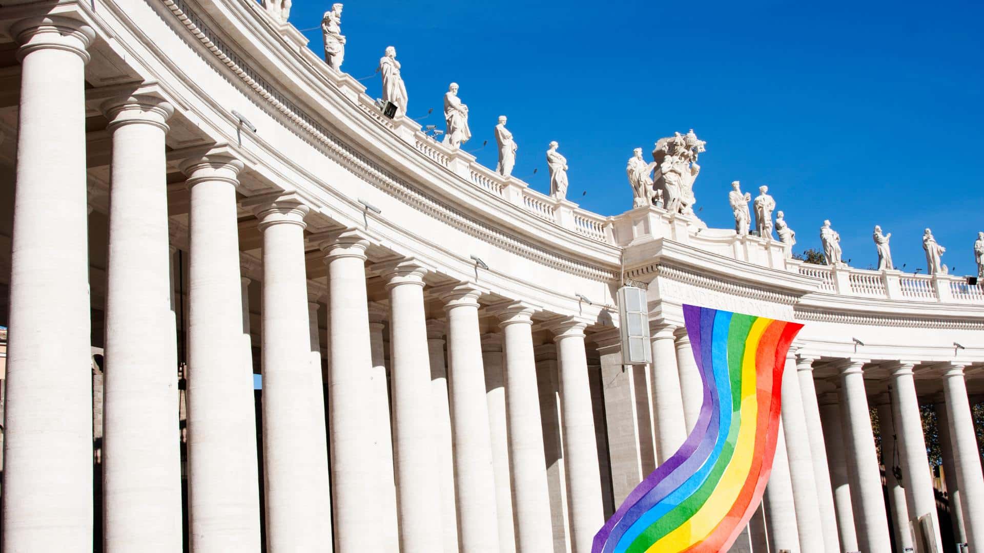 Vatican City with an LGBT flag superimposed to seem waving in welcome.